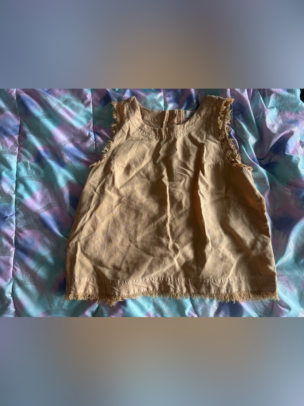 Woman’s Sleeveless Fringe Hem shirt